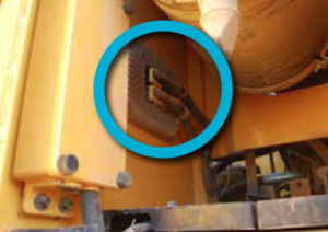 Excavator electrical harness circled in blue.