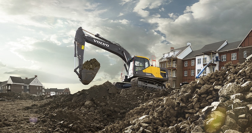 Volvo medium excavator transferring grime on a residential construction set.